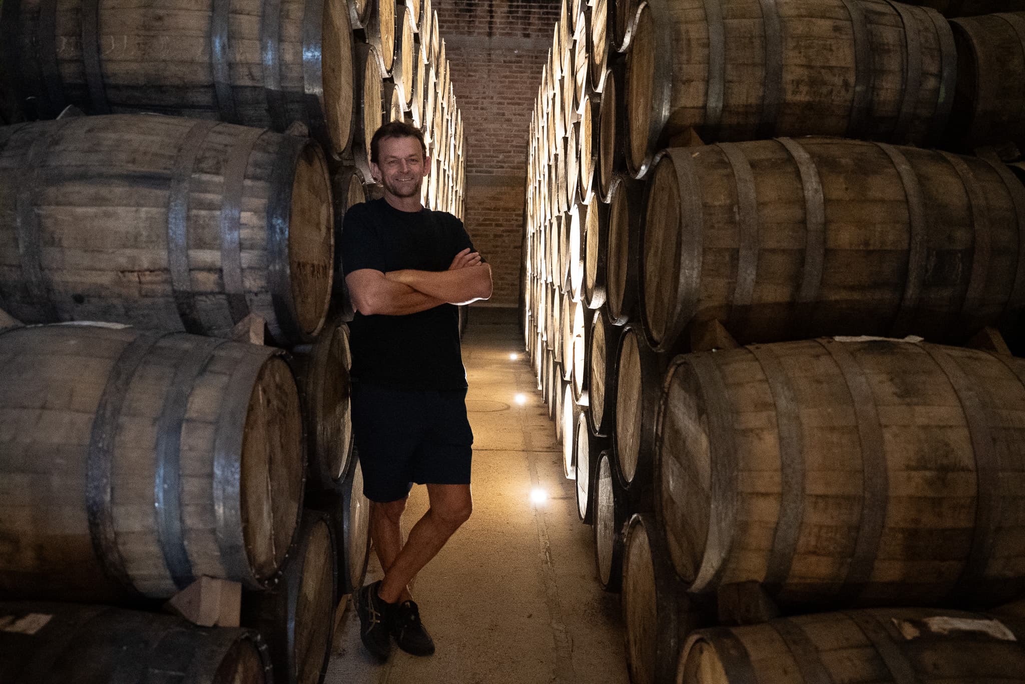 Adam Gilchrist among the ageing barrels at the distillery in Jalisco